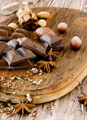 Wall Mural - pieces of chocolate with nuts and cinnamon