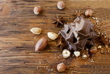 Wall Mural - pieces of chocolate with nuts and cinnamon