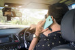 © kanchitdon - Arab man talking by phone while driving a car.