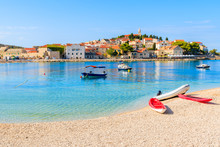 Kayaks And Boats On Beach In Primosten Town, Dalmatia, Croatia