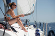 © ventura - Young woman on deck of sailing yacht enjoying the vacation