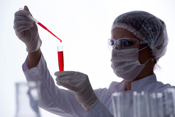 Female scientist researcher conducting an experiment in a labora