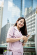 © kapturephoto - Young asian business lady  working outdoors