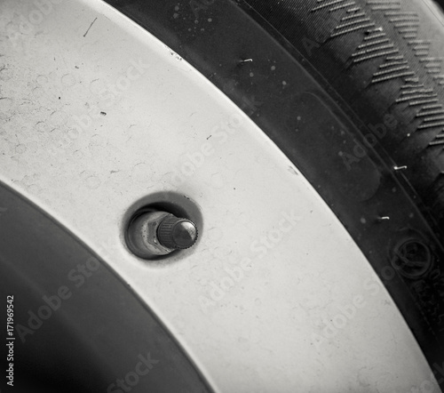 Как снять сосок с колеса Close-up nipples wheels car. Tyre valve фотография Stock Adobe Stock