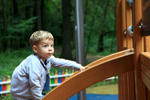 Child Climbing On Slide