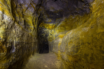 Wall Mural - Artificial sandstone cave. Cave monastery. Abandoned abode of sectarians whips and scopes. Tula region, Russia