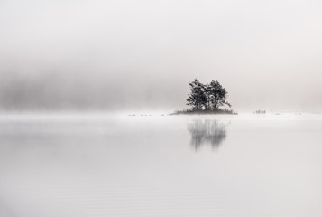 Peaceful and simple view from island at the lake in National Park, Finland.