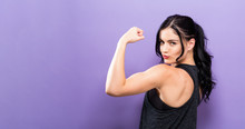 Powerful Young Fit Woman On A Solid Background