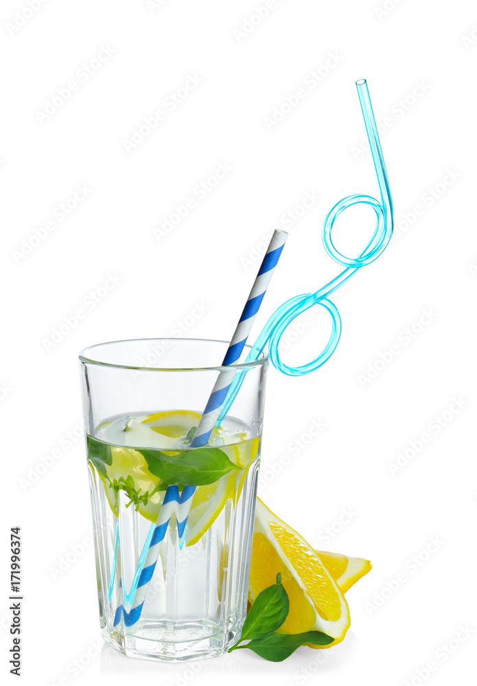 Basil water with lemon in glass, isolated on white