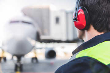 Mechanic working in headset at airport