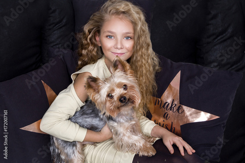 Stunning Beautiful Little Girl With Long Blond Hair Lies On The