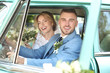 © Africa Studio - Happy wedding couple in car