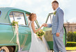 © Africa Studio - Happy wedding couple and decorated car outdoors