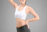 Fototapeta  - Young woman on gray background. Diet concept