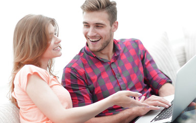 Wall Mural - closeup of young couple with laptop