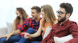© ASDF - group of smiling young people sitting on the couch