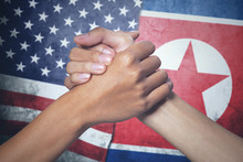 Hands With North Korea And United States Flag