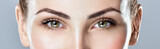 Fototapeta  - Closeup shot of woman eye with day makeup. Long eyelashes