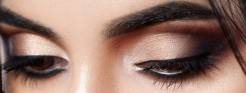 Closeup shot of woman eye with evening makeup. Long eyelashes. Smokey Eyes - obrazy, fototapety, plakaty 