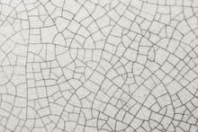 Cracked White Ceramic Of Tile Close Up Background And Texture