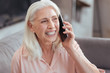 © Viacheslav Yakobchuk - Joyful senior woman talking on smart phone