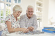 © Monkey Business - Senior couple doing a jigsaw puzzle at home