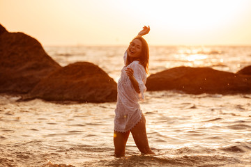 Sticker - Side view of happy brunette woman in light summer dress