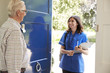 © Monkey Business - Senior man greeting female nurse making home visit