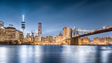 Fototapeta  - Brooklyn Bridge and Freedom Tower at night, Lower Manhattan, view from Brooklyn Bridge Park in New York City, USA