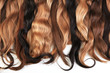 © mstudio - Mix of natural extensions hair: blond, red, brown. Strands of hair for hairstyles. Isolated on white background.