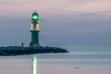 Night View Of Lighthouse Of Warnemuende On The Baltic Sea At The
