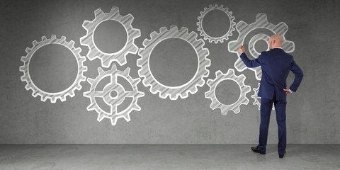 Poster - Businessman drawing gears sketch on a wall 3D rendering