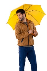 Wall Mural - Man standing under umbrella