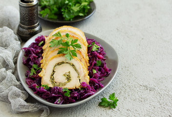 Canvas Print - Fried pork loin stuffed with greens and red cabbage.