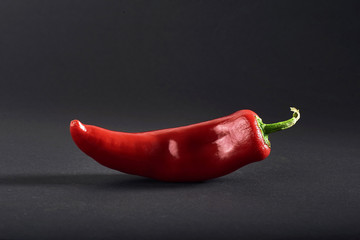 Red chili peppers isolated on a black background