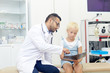 © pressmaster - Little girl looking at x-ray image while doctor explaining it