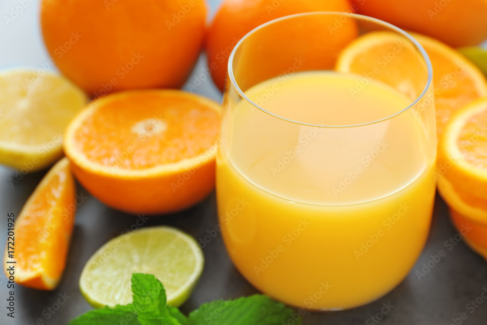 Glass of fresh orange juice on table, closeup