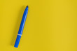 blue marker on yellow paper background