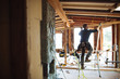© Rob and Julia Campbell/Stocksy - Carpentry contractor using hammer on interiour build