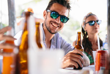 Handsome Man In Mirrored Sunglasses With Bottle Of Beer