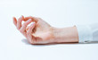 © BONNINSTUDIO/Stocksy - Female's hand over white background.