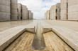 Symmetrical architecture of the Salk Institute in San Diego with fountain vanishing point