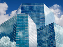 Blue Sky And Clouds Reflecting In Windows Of Modern Office Building