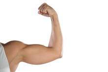 Cropped Image Of Sportswoman Flexing Muscles
