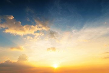 Wall Mural - Sky background at sunset,Sky blue and orange light of the sun through the clouds in the sky
