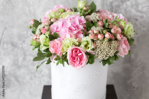 Obraz na PCV Beautiful tender bouquet of flowers in white box on gray ackground with space for text