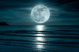 Fototapeta Łazienka - Super moon. Colorful sky with cloud and bright full moon over seascape.