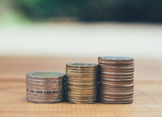 Money Thai baht stack of coins on wooden table  background, Concept of financial, Saving concept