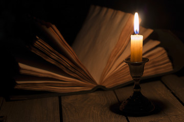 Old book and candle