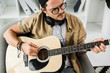 © LIGHTFIELD STUDIOS - man playing guitar